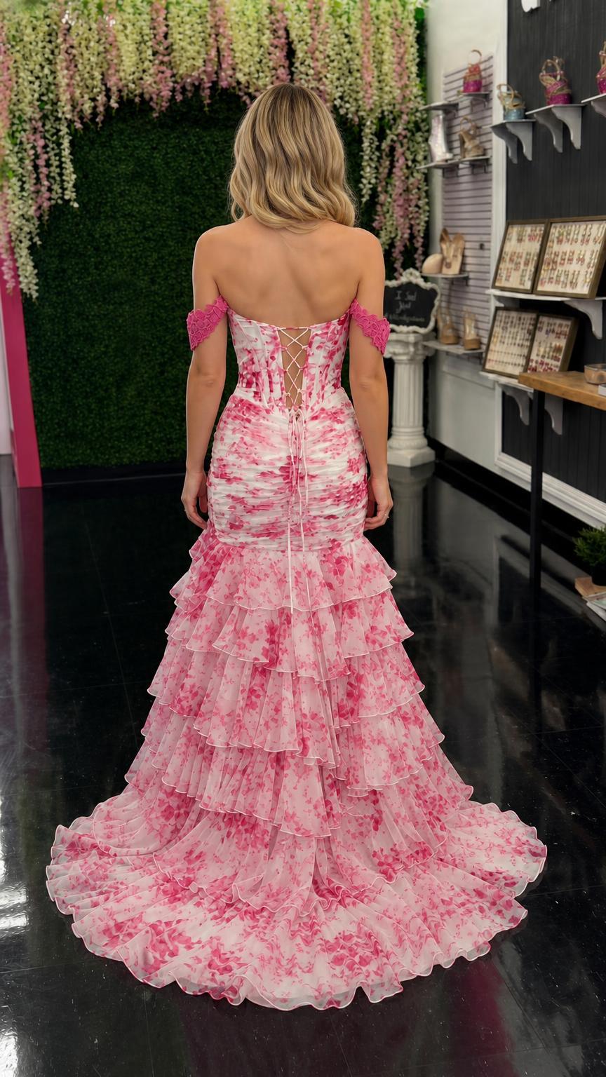 Back view showing lace-up corset and ruffled train