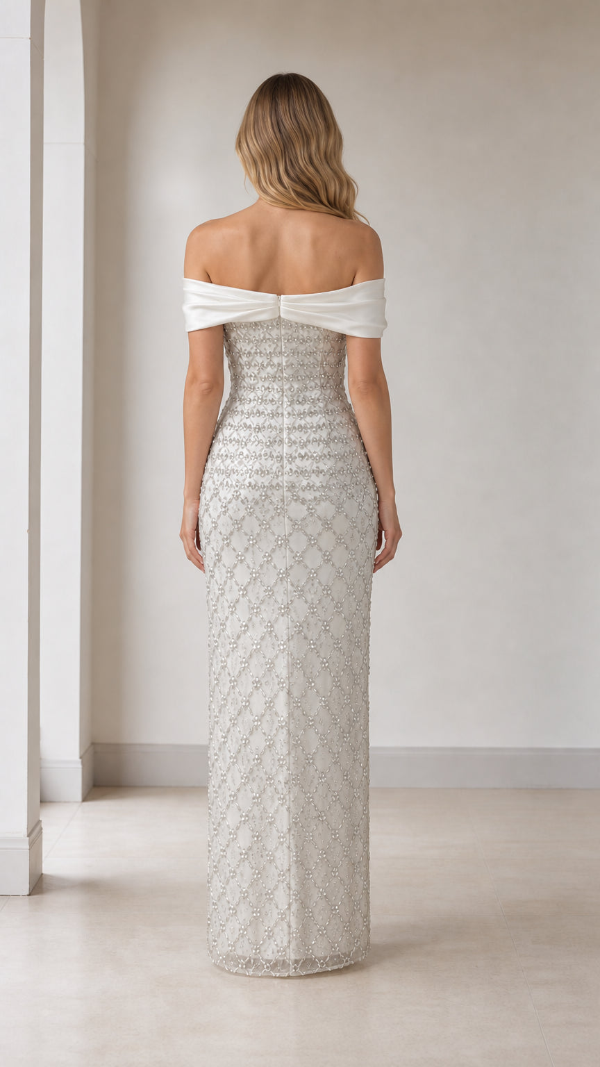 Back view of white off-shoulder beaded evening gown