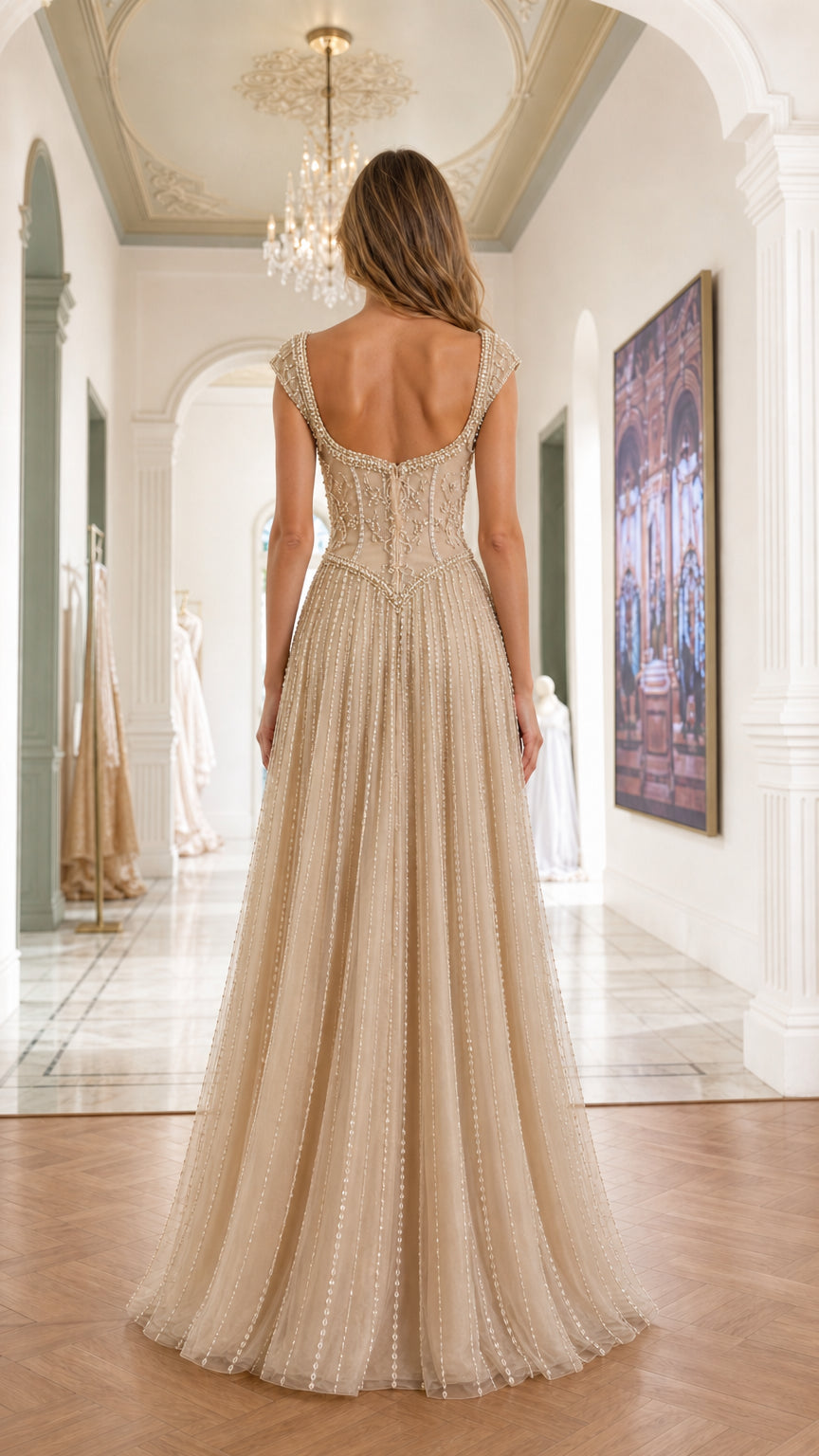 Back view showing scooped back design of champagne gown