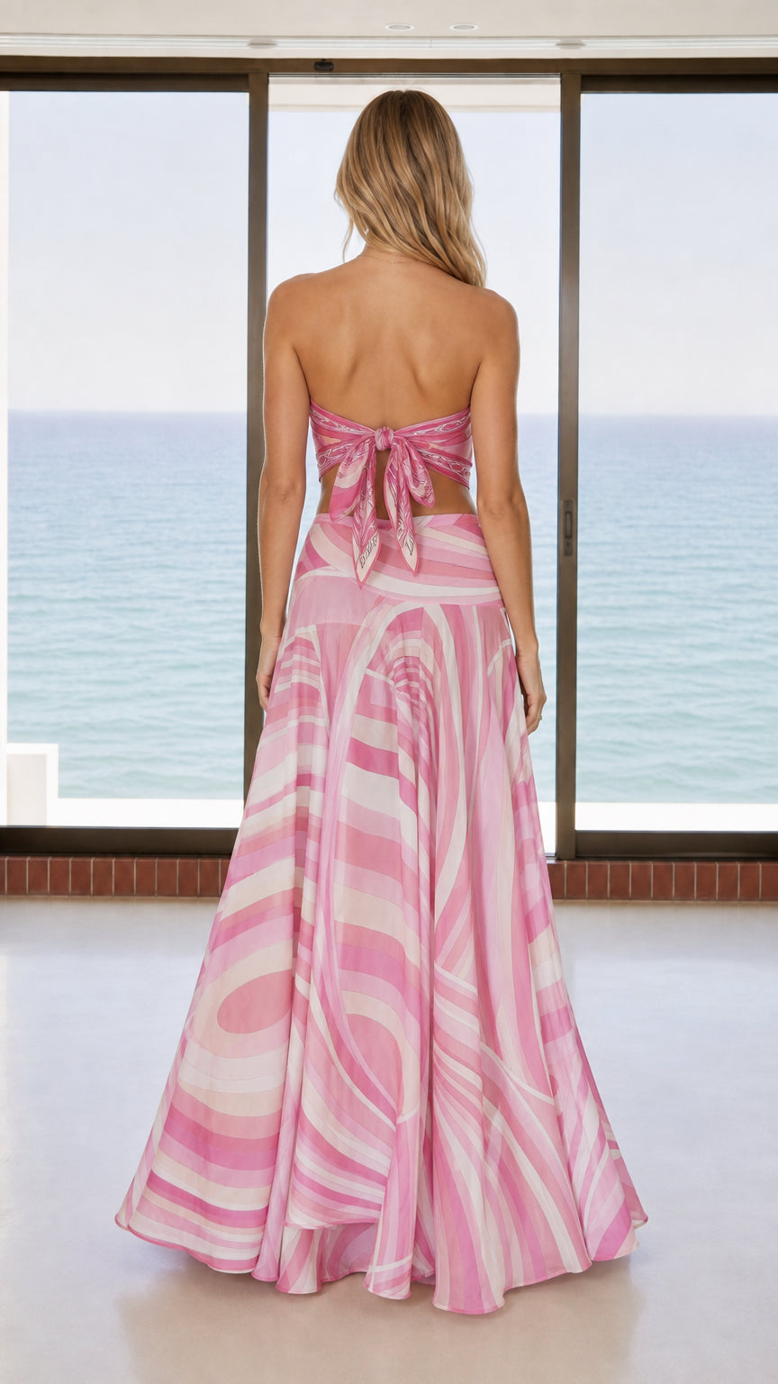 Back view of woman showing adjustable tie-back detail on pink scarf top