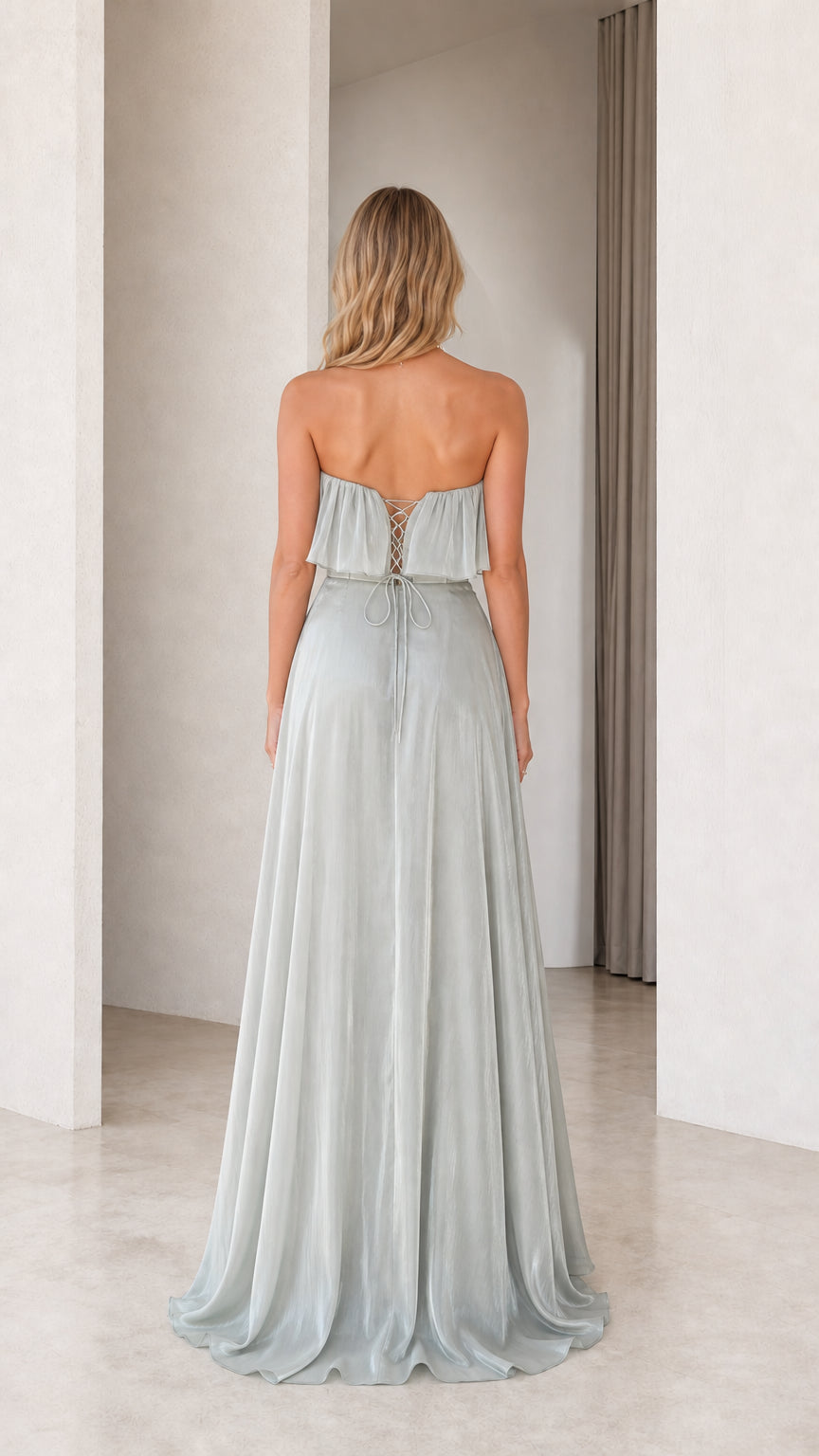 Back view showing lace-up closure of the sage green dress