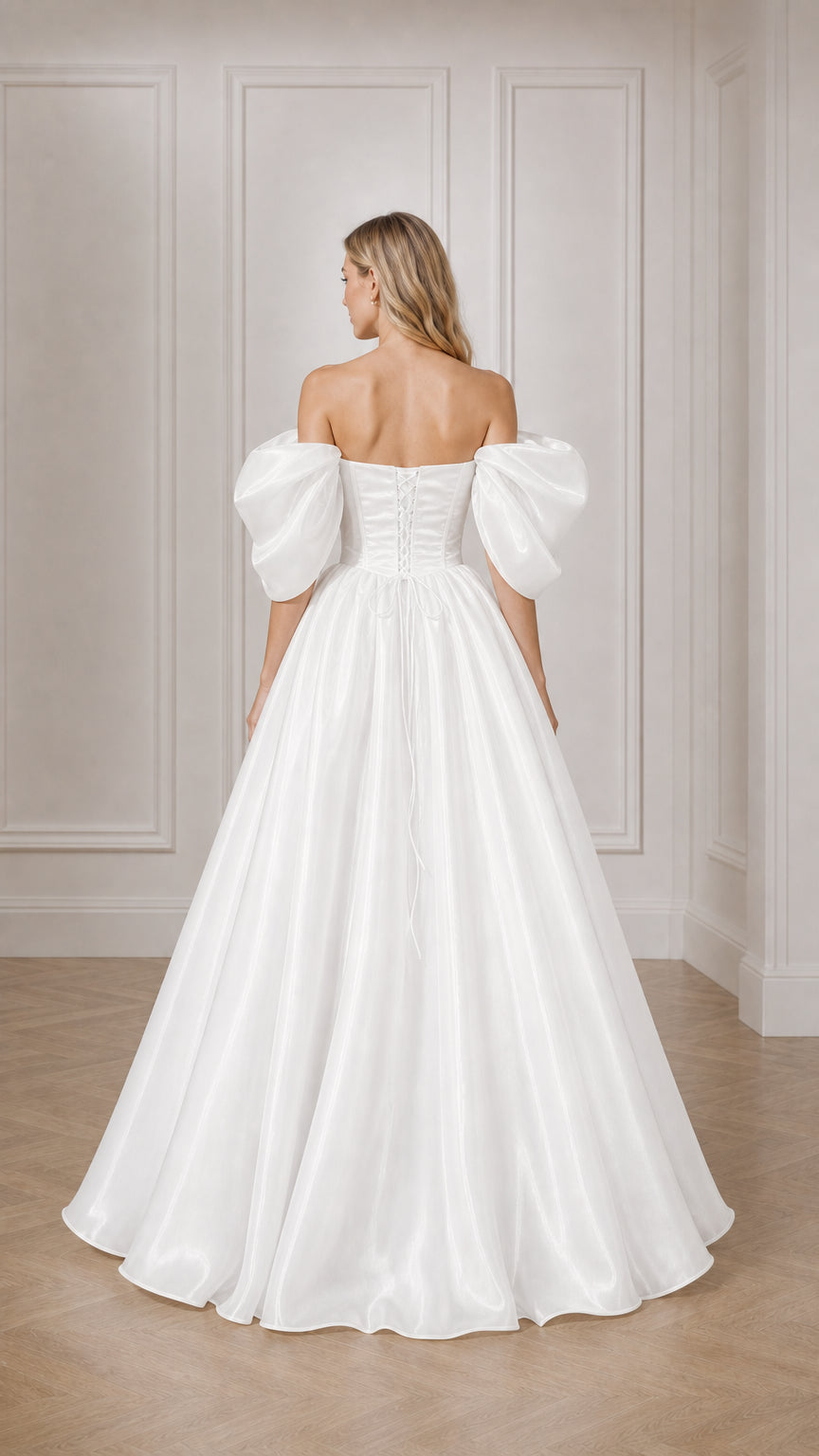 Back view of woman showing lace-up back detail of white ball gown