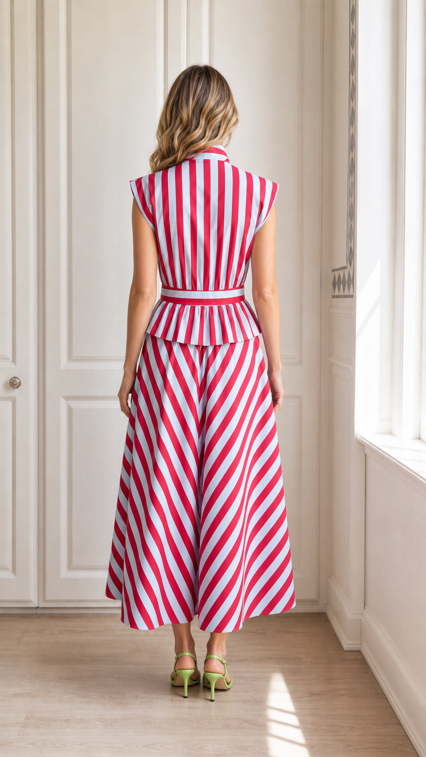 Back view of model in red striped midi dress