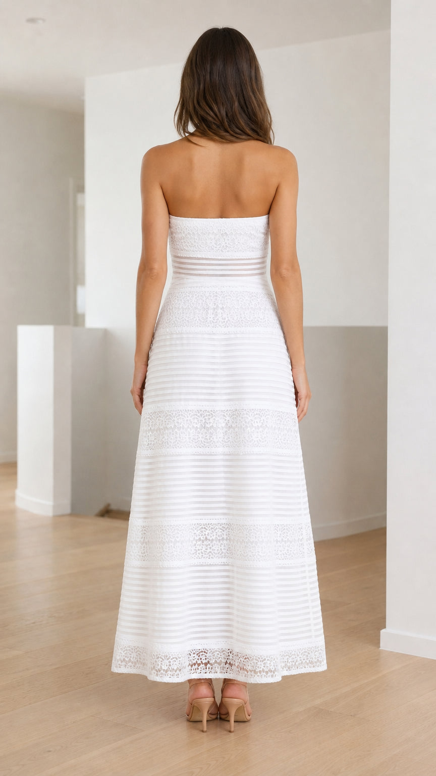 Back view of white strapless lace maxi dress