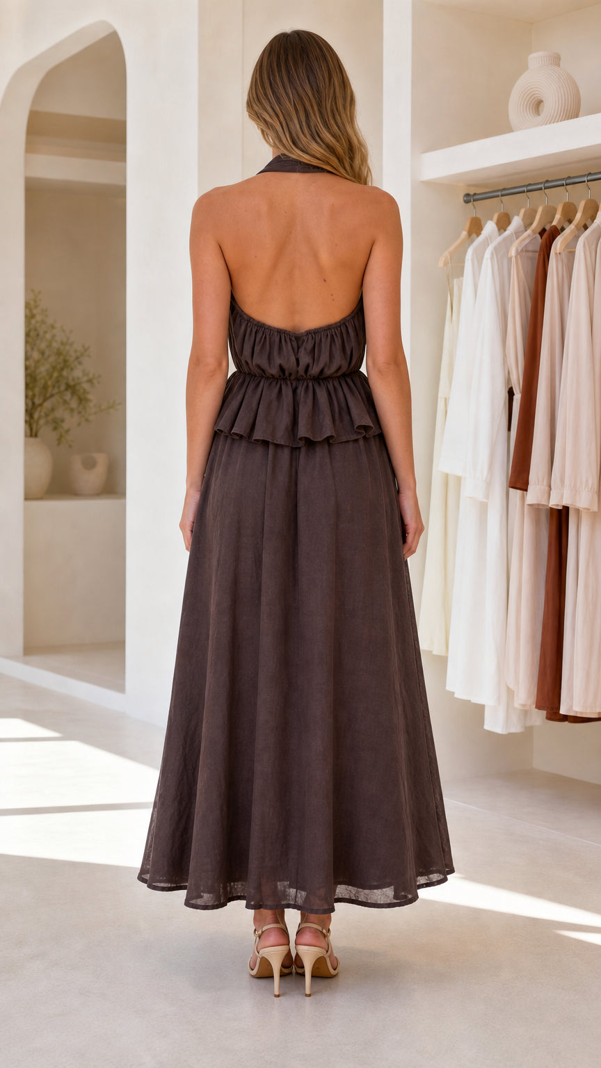 Back view showcasing open back and halter straps of dark brown maxi dress