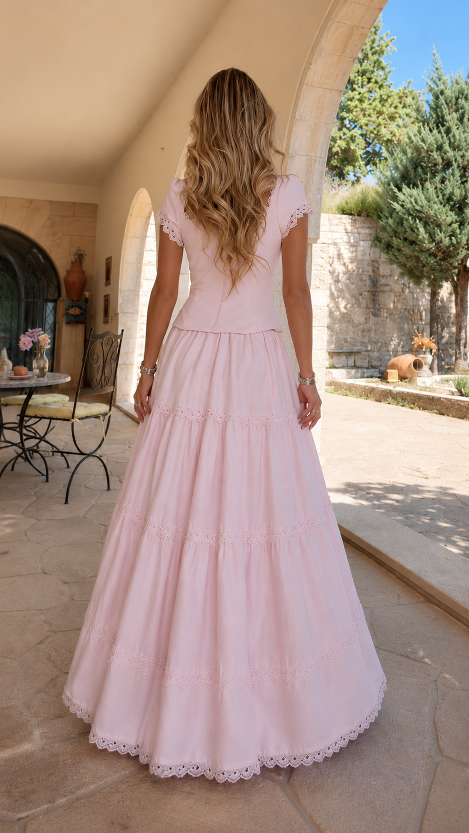 Back view of blush pink cap sleeve tiered maxi dress