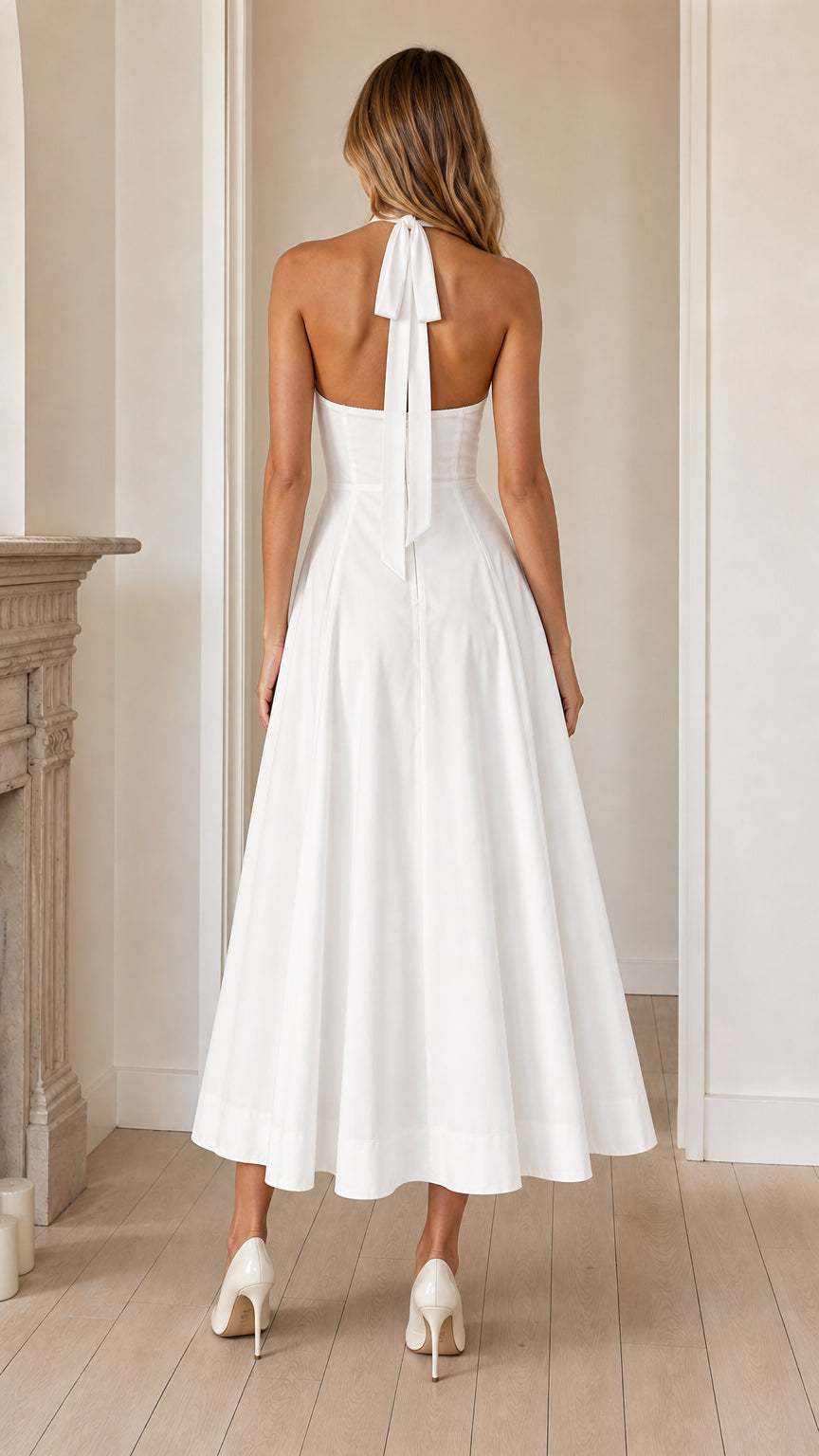Back view showing self-tie halter straps on white dress