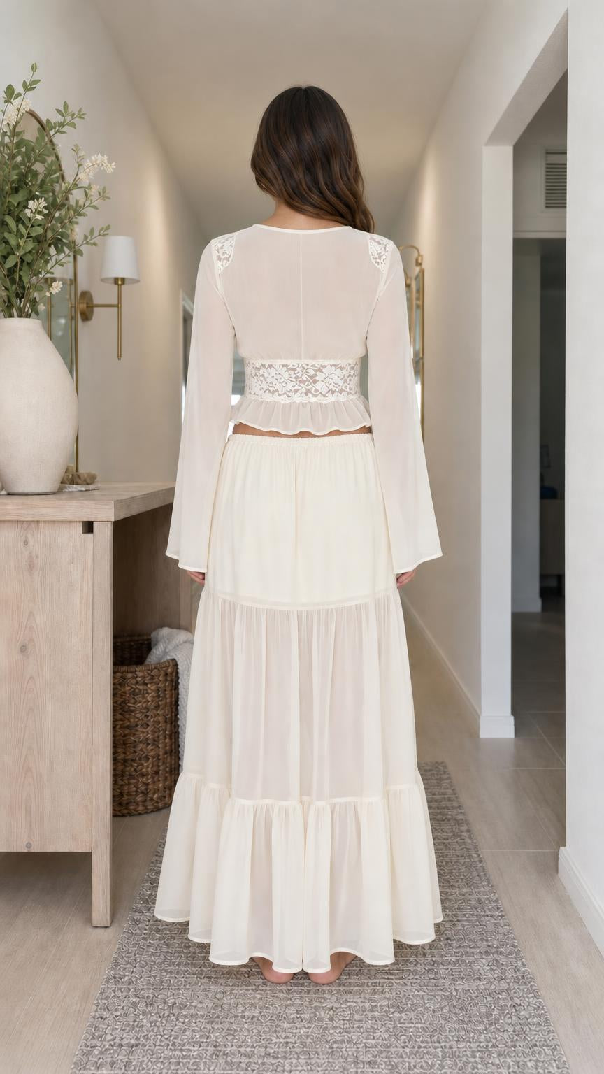 Back view of model wearing cream matching set