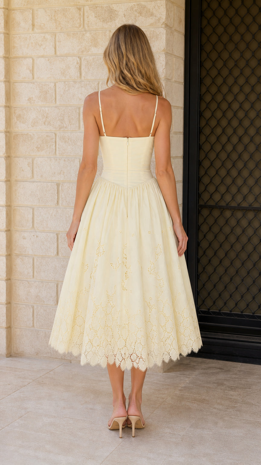 Back view of yellow midi dress showing zipper and straps