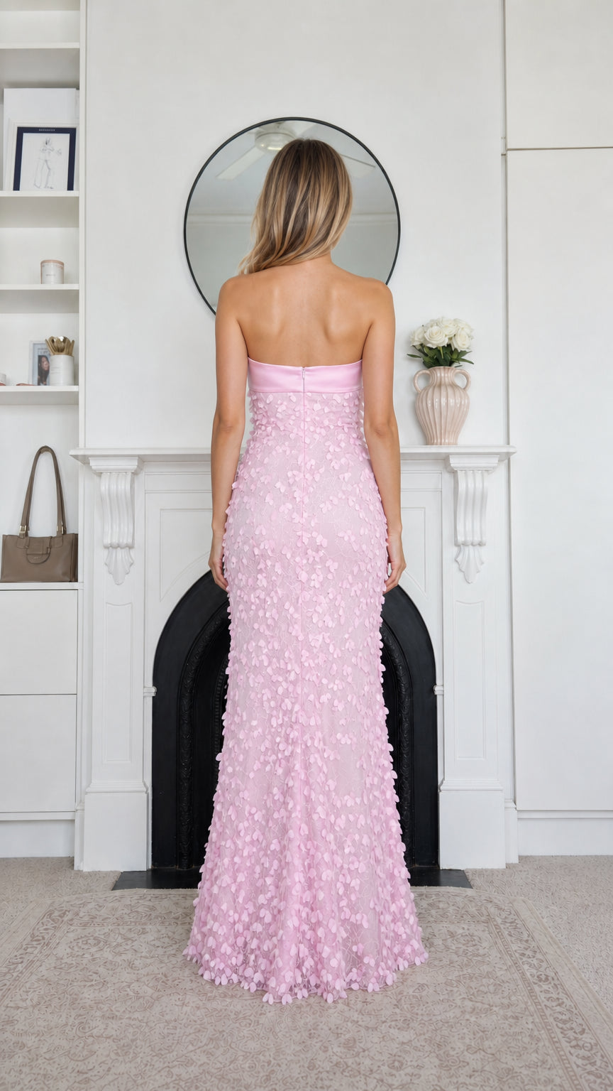 Back view of pink strapless evening gown