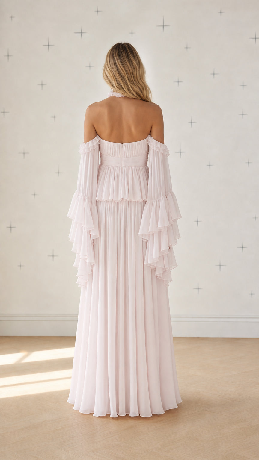 Back view of pink chiffon maxi dress showing pleated draping