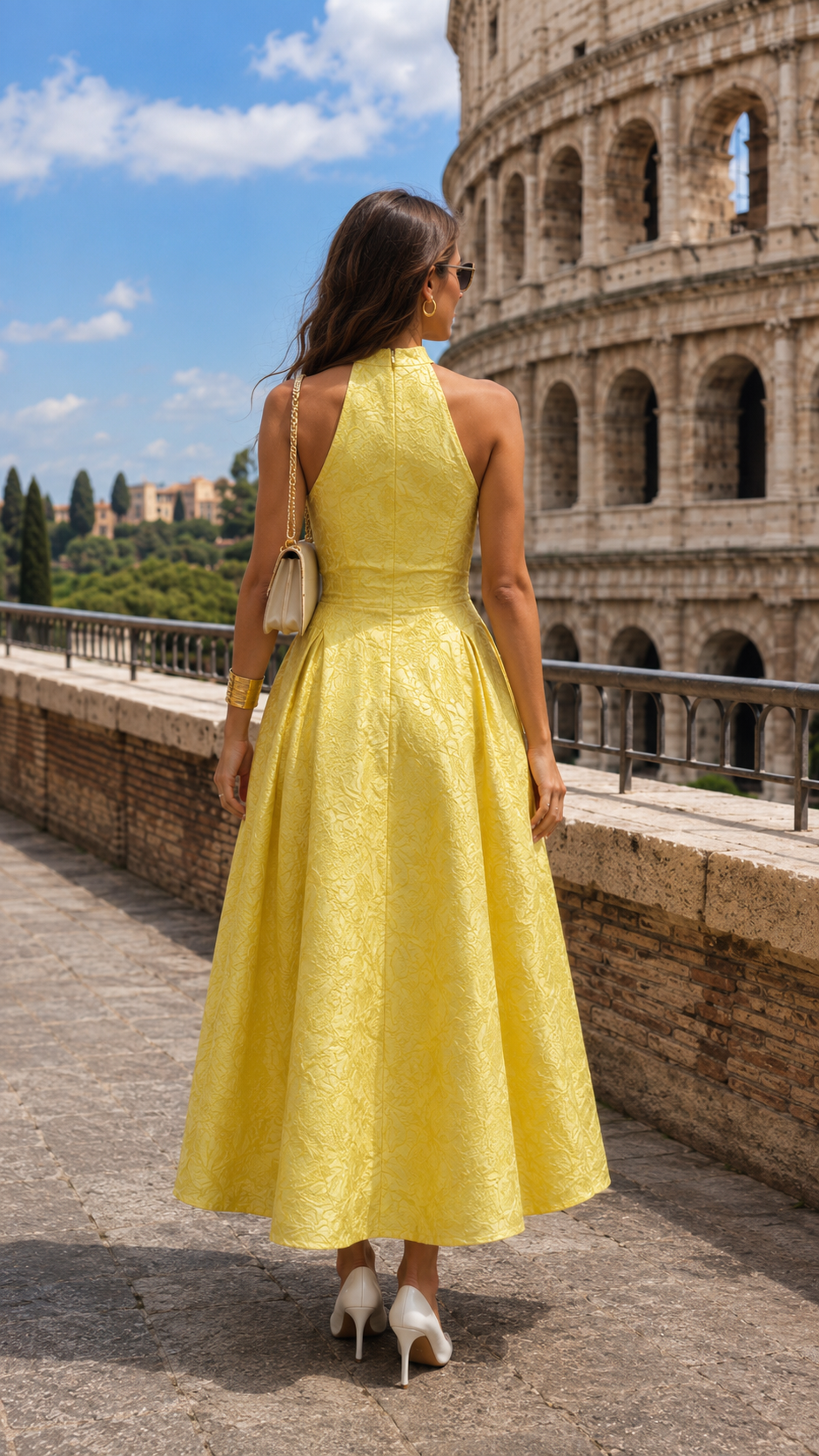 Back view of butter yellow halter neck midi dress with open back