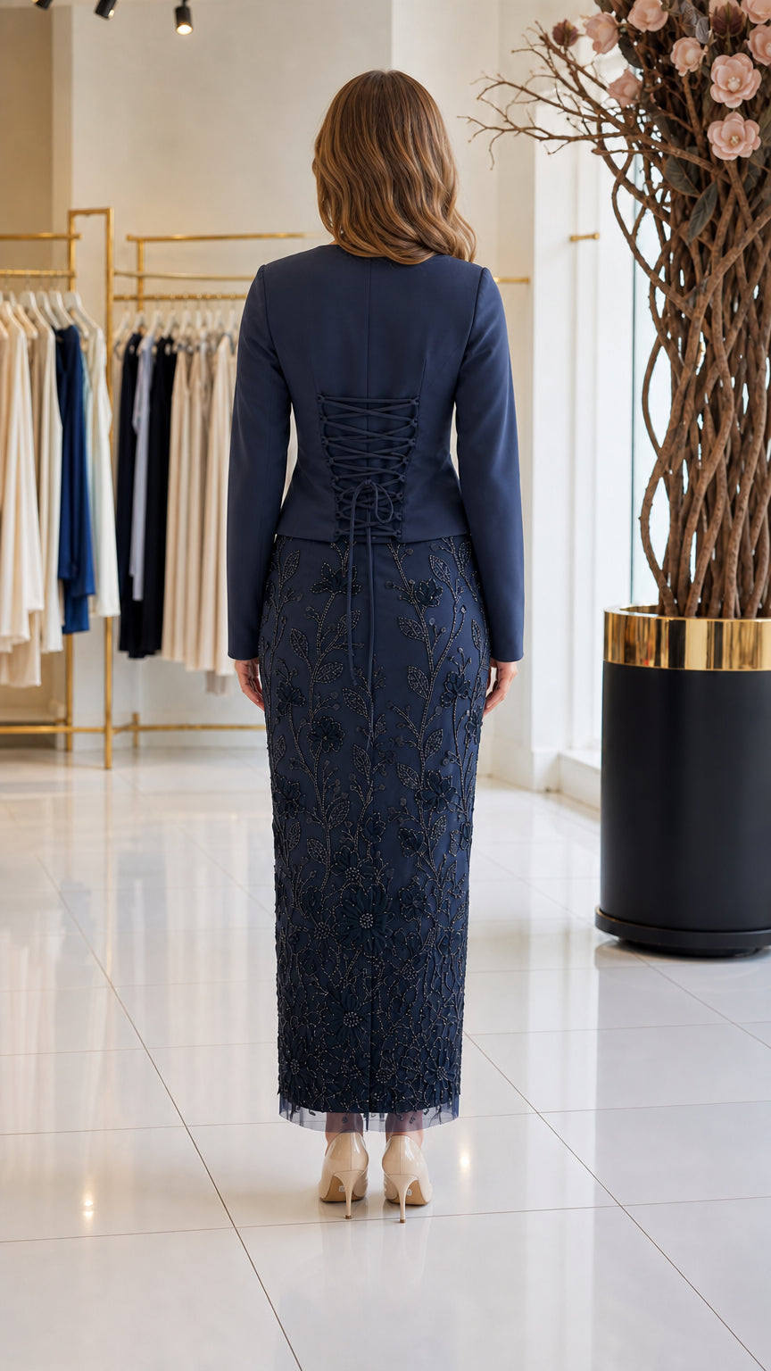 Back view of navy blue formal dress highlighting lace-up corset detail