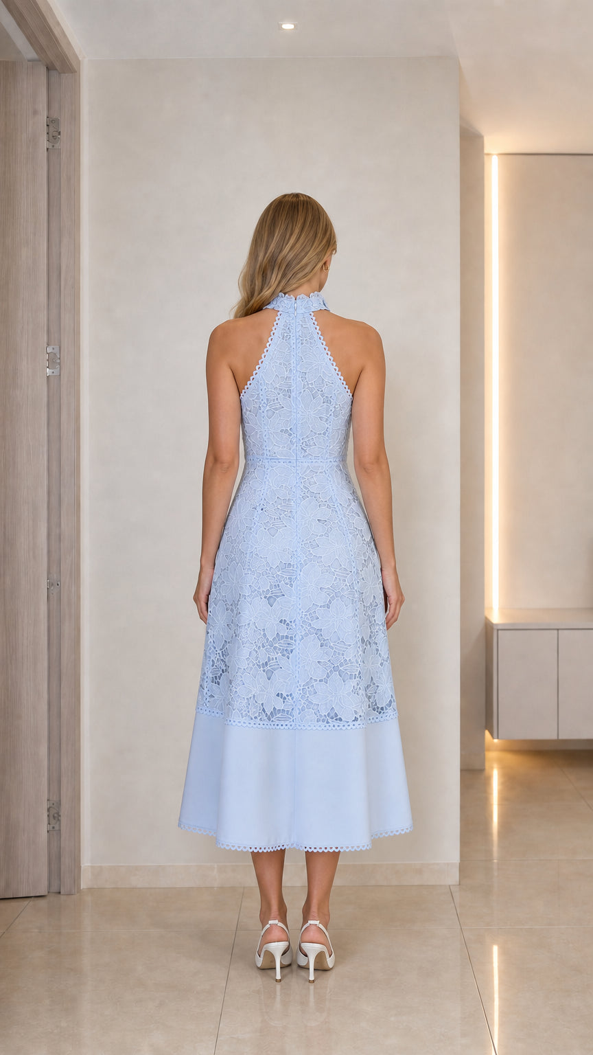 Model wearing light blue lace midi dress back view