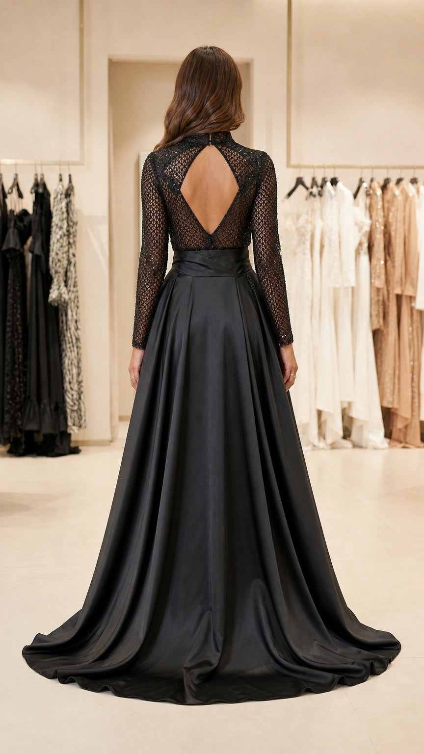 Back view of black jumpsuit highlighting keyhole cutout and overskirt train
