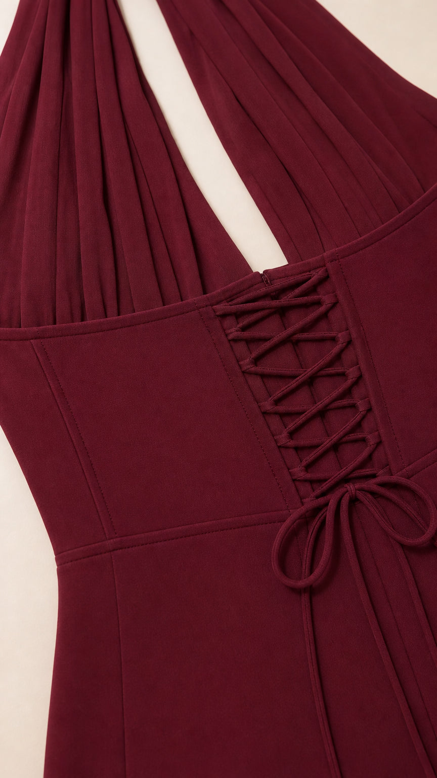 Close-up of lace-up corset back and halter neckline detail