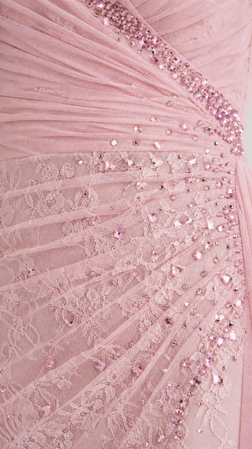 Close-up detail of beaded embellishments and ruched fabric