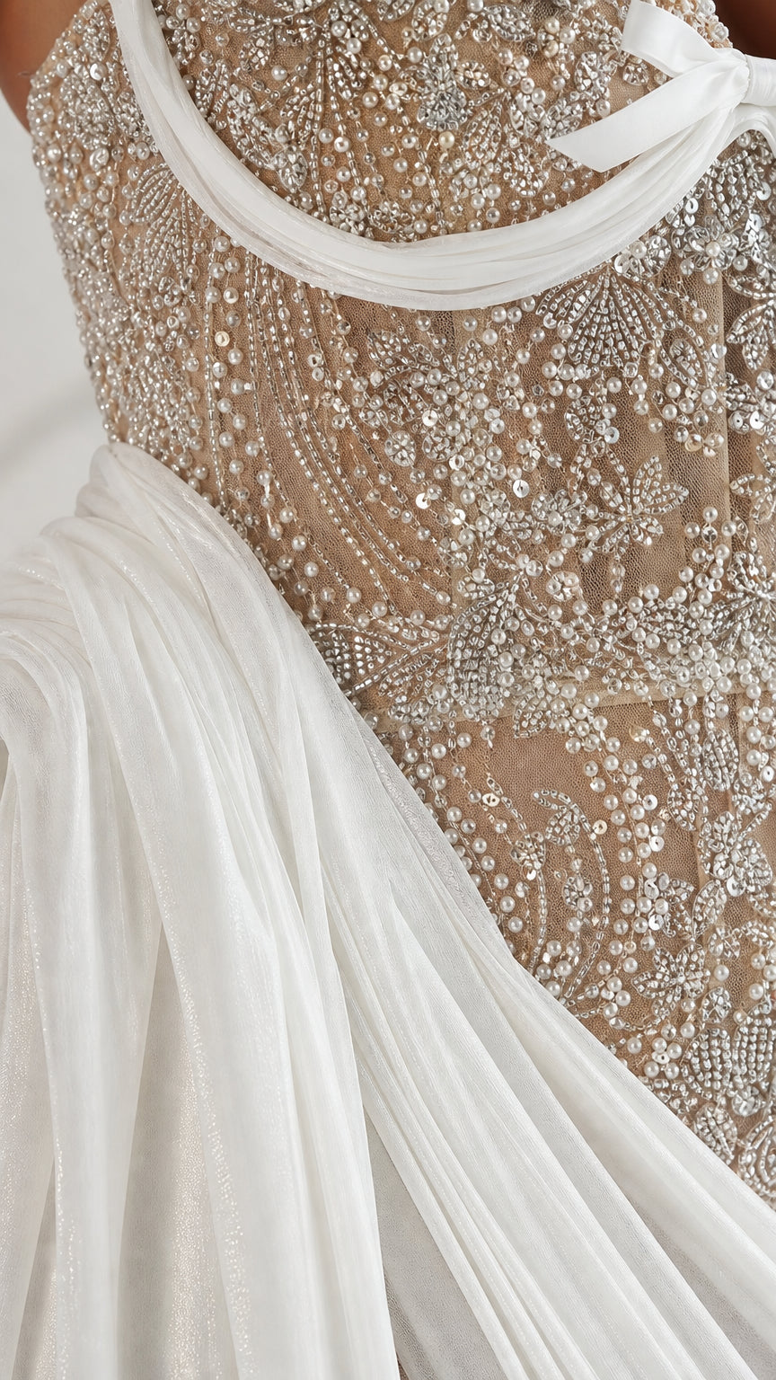 Close-up detail of intricate beadwork, sequins, and embroidery on the bodice