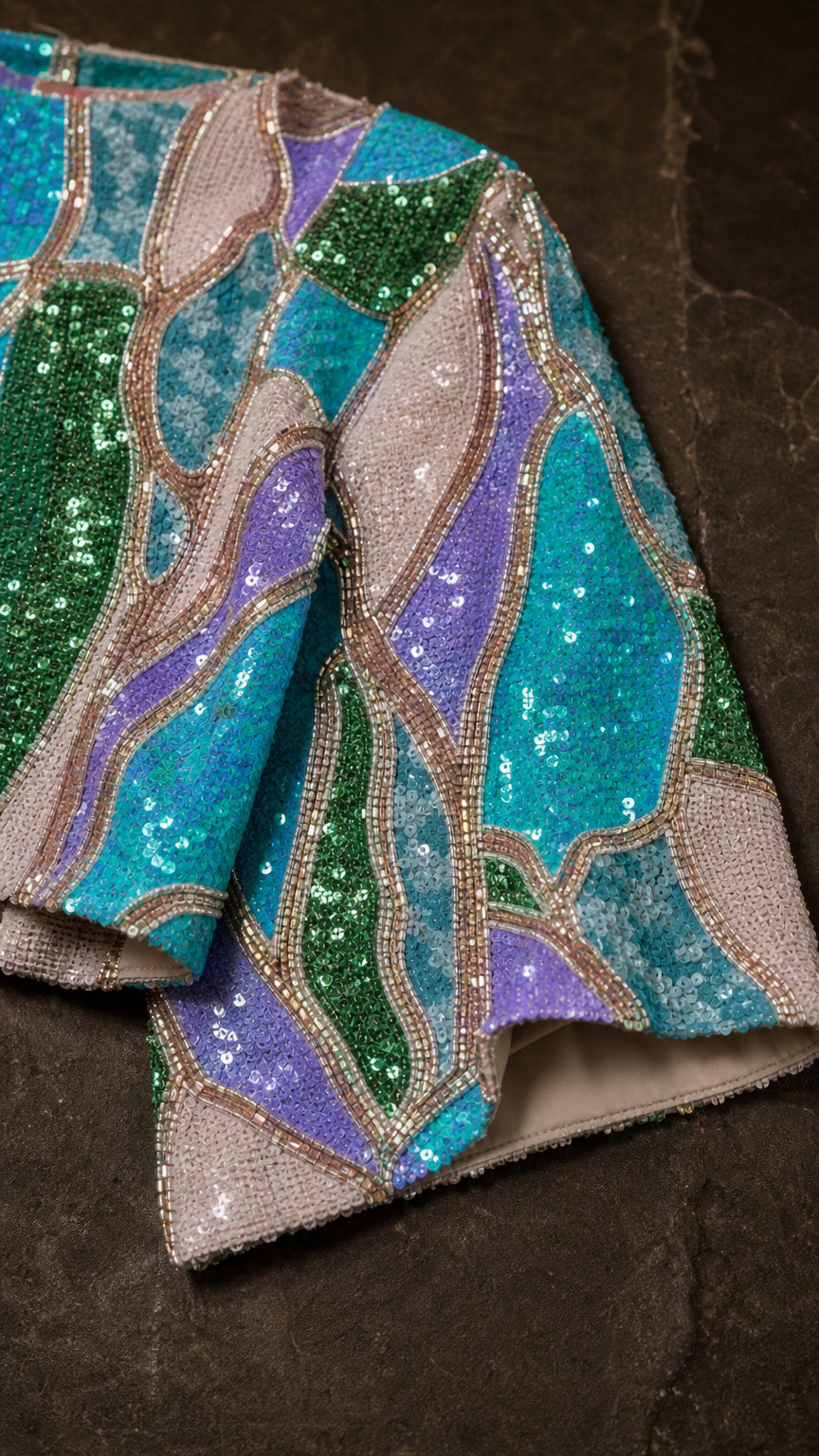 Close up of Blue Multi sequin fabric texture and abstract pattern