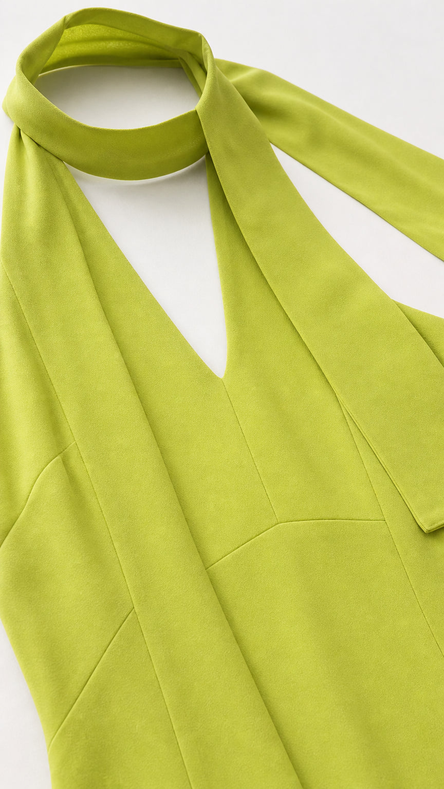 Close-up detail of the halter neckline and integrated neck scarf