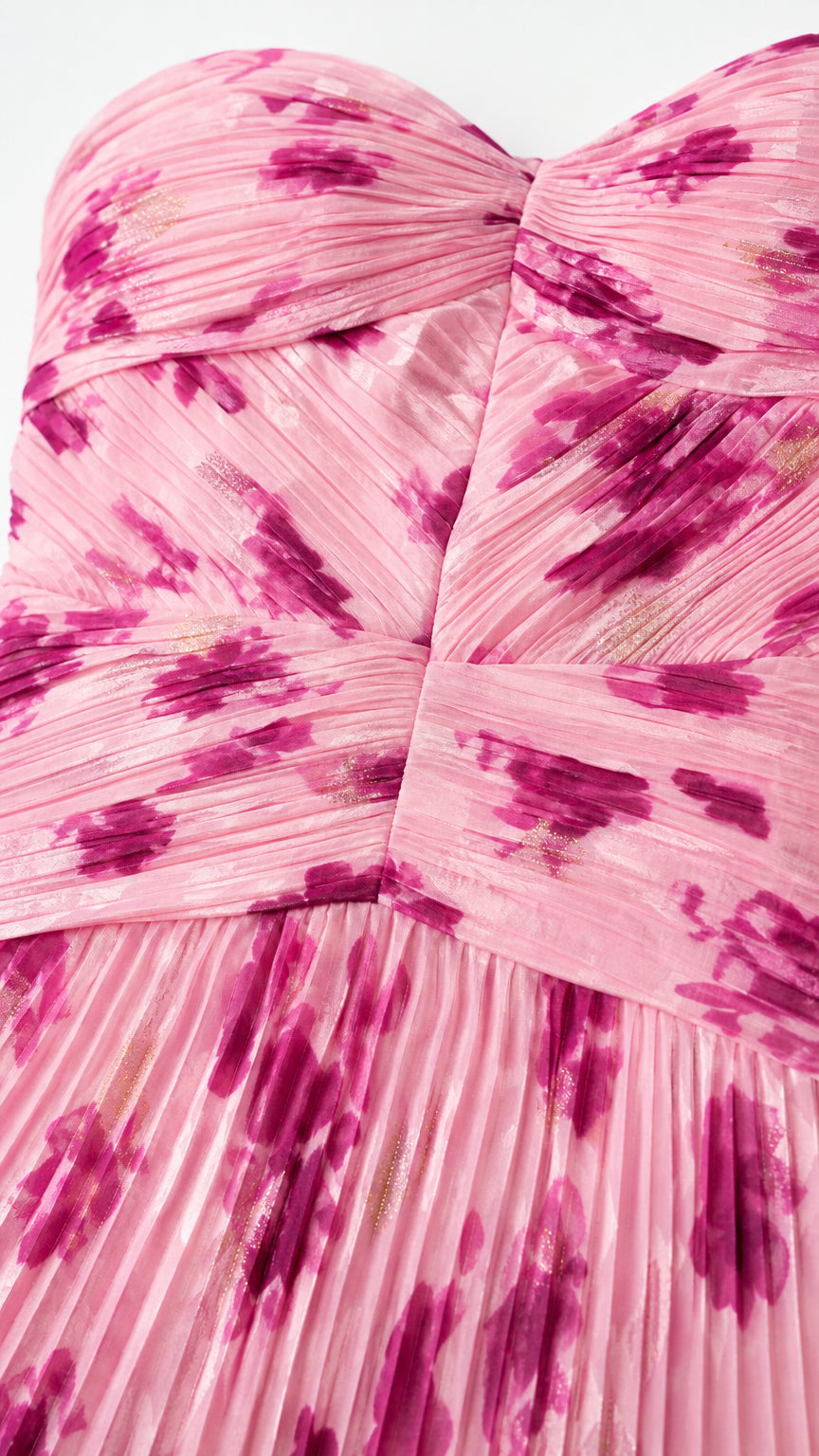 Close-up detail of ruched bodice and pleated texture in pink floral