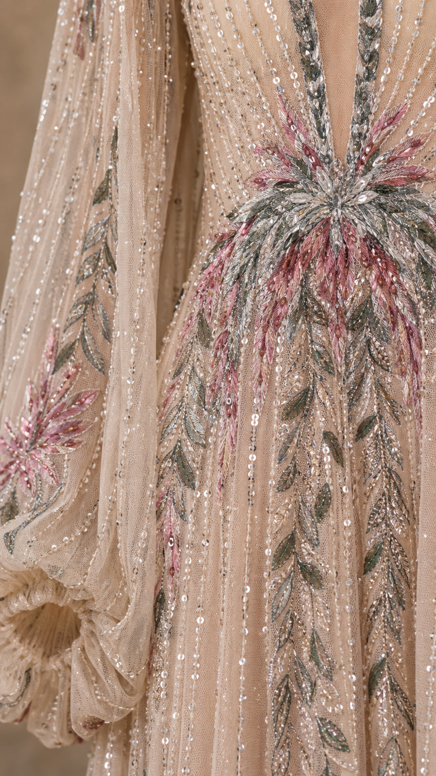 Close-up detail of intricate beadwork and embroidery on the bodice and sleeves