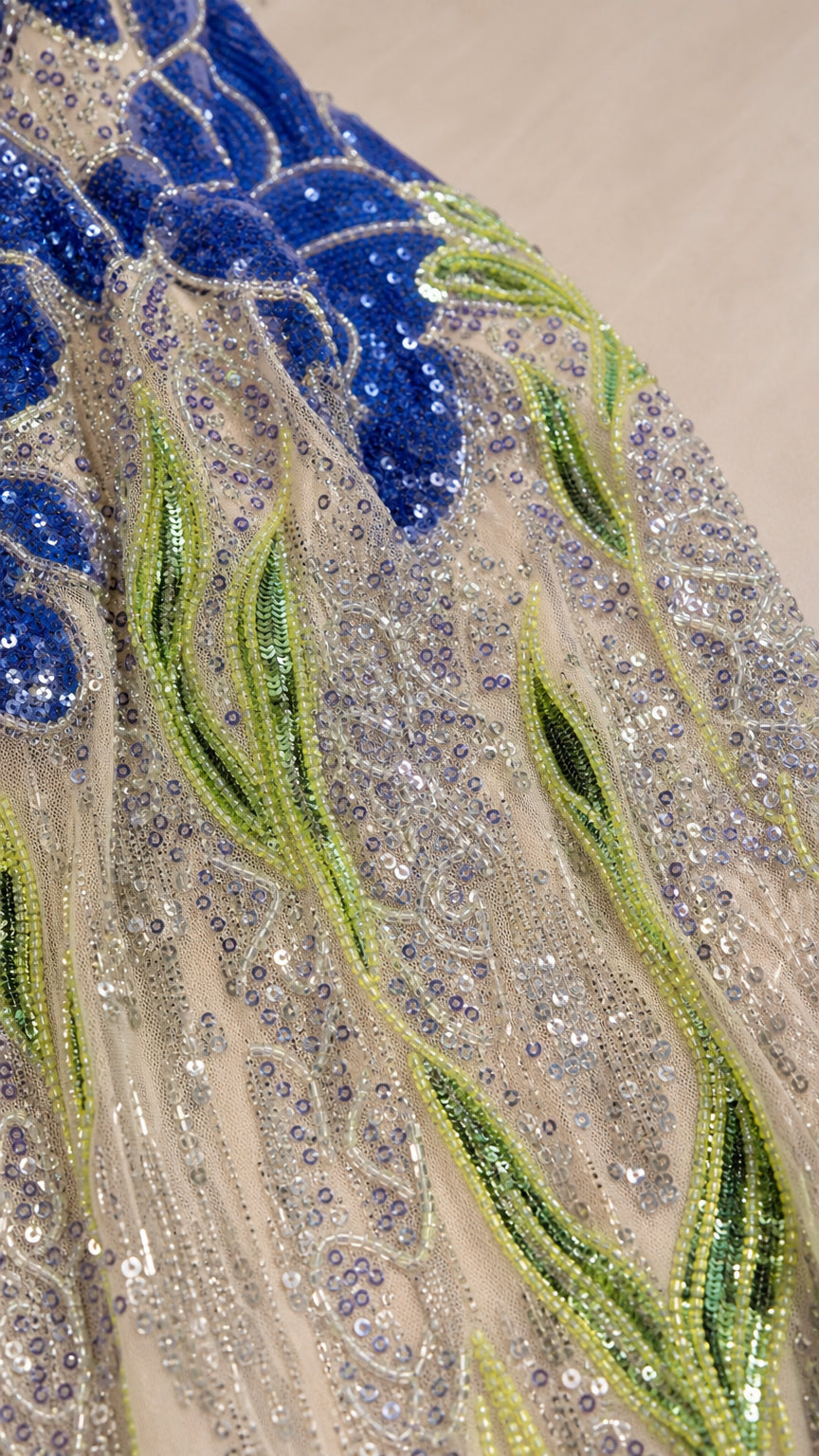 Close-up detail of sequin and bead botanical embroidery