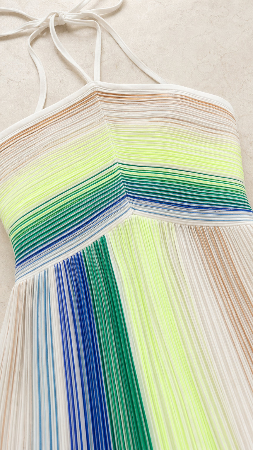 Close-up detail of chevron bodice and vertical pleats