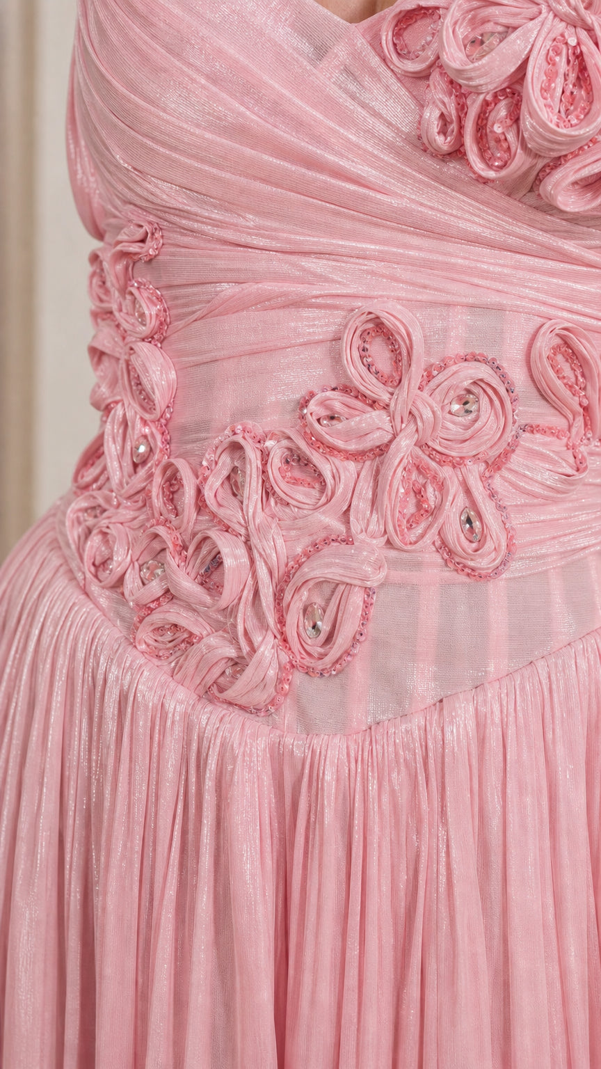 Close-up of handmade floral appliques and bodice detailing on pink dress