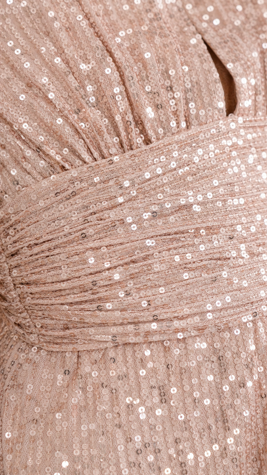 Close-up of champagne sequin fabric and ruched waist