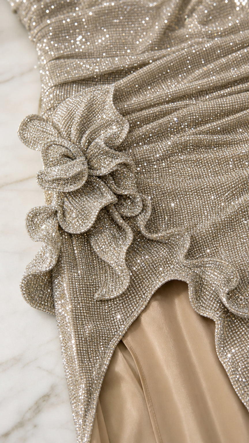 Close-up detail of 3D floral appliqué and sequin texture