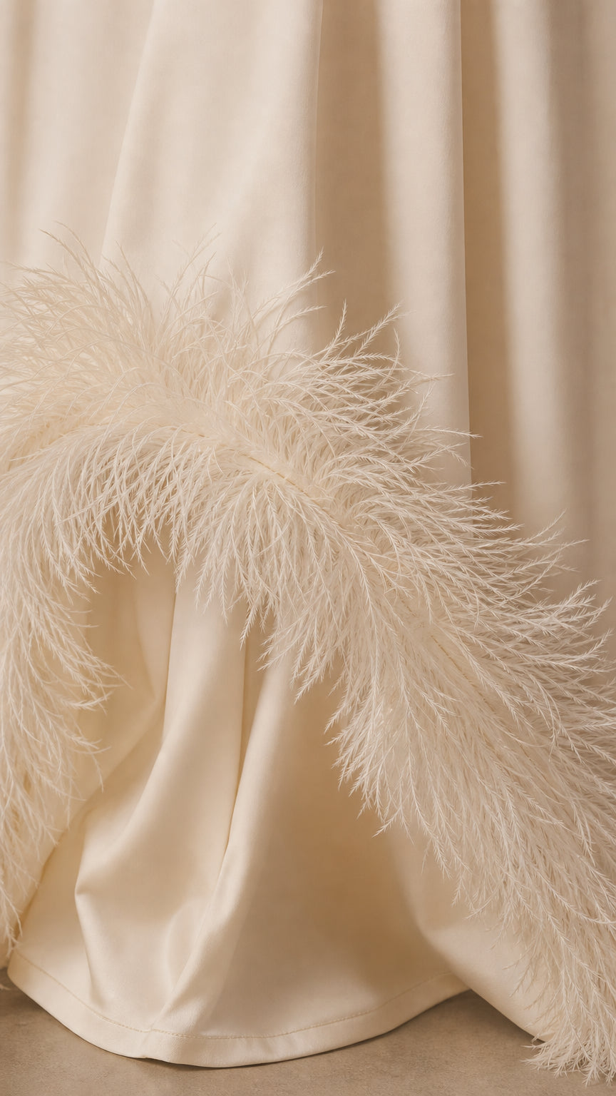 Close-up detail of plush feather trim on dress hem