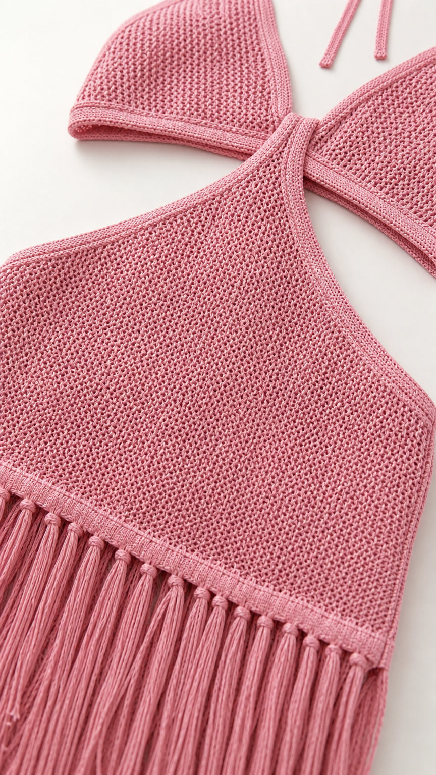Close-up detail of halter neckline and textured knit fabric in pink
