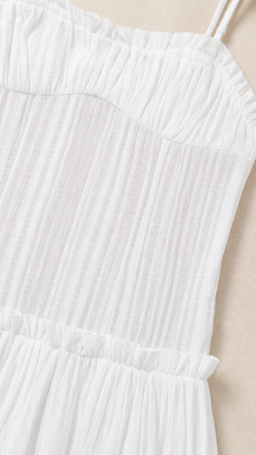 Close-up detail of White pleated bodice and straps