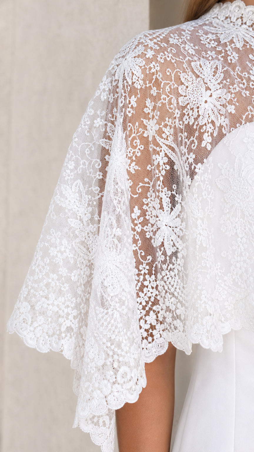 Close-up detail of White floral lace overlay and sleeve