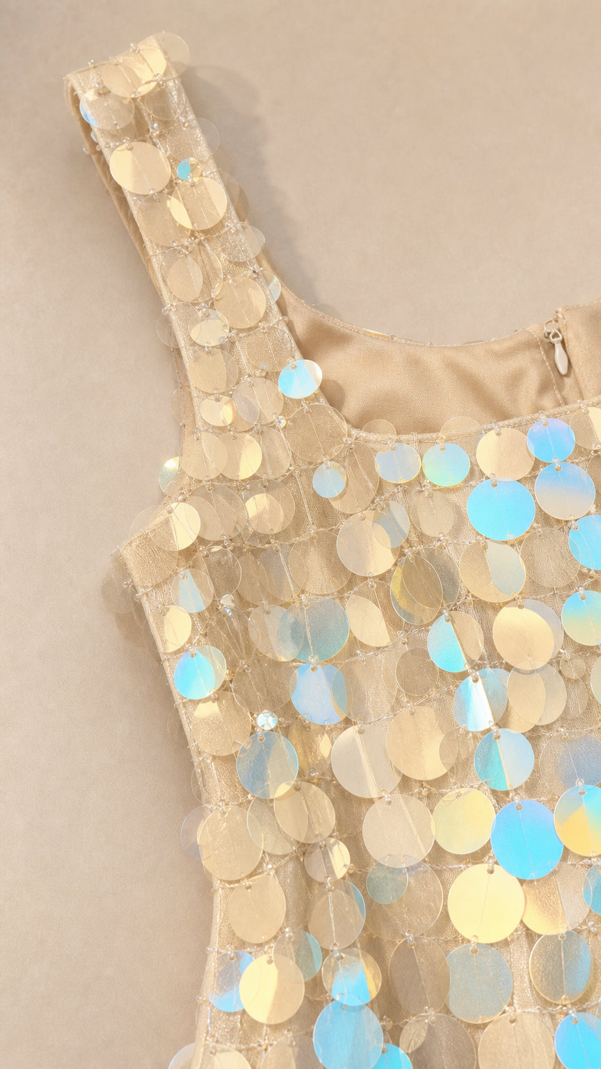Close-up detail of square neckline and iridescent sequins