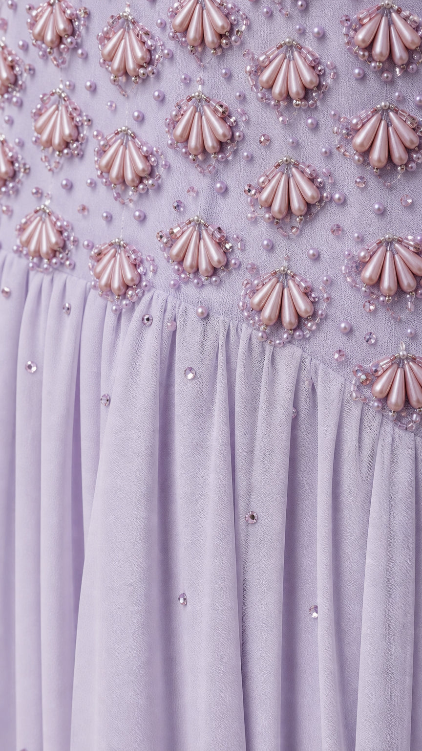 Close-up detail of beaded bodice and textured embellishments