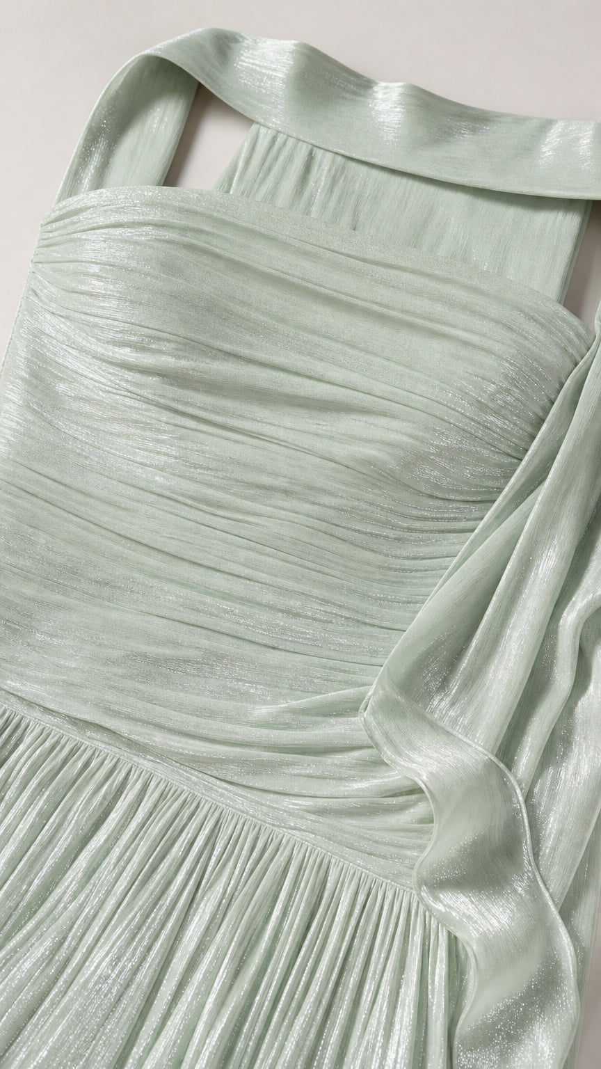 Close-up detail of pleated fabric and strapless neckline