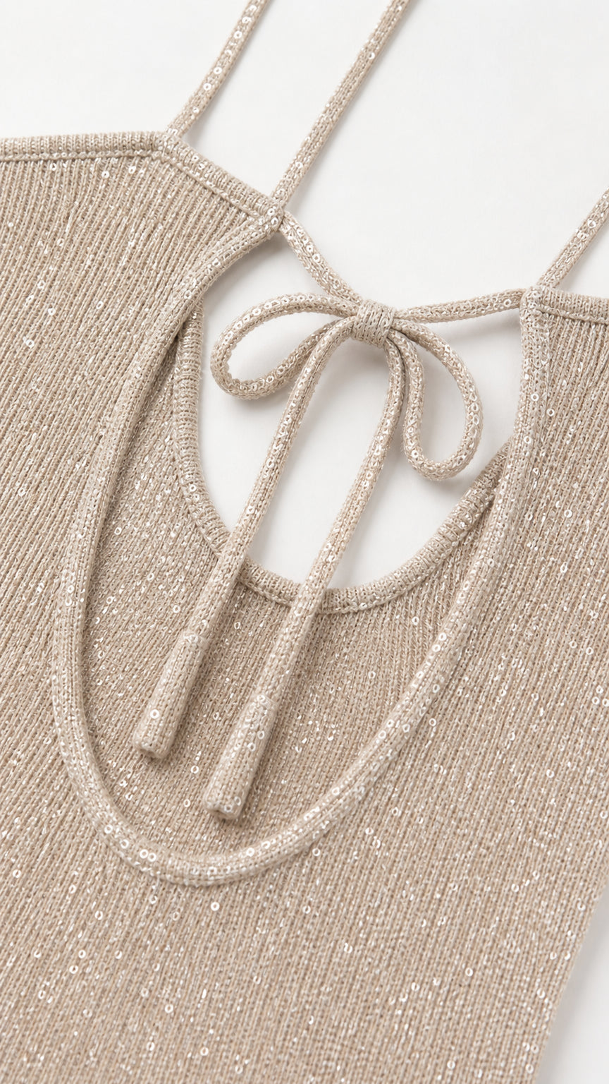 Close-up detail of straps, neckline, and sequin knit texture