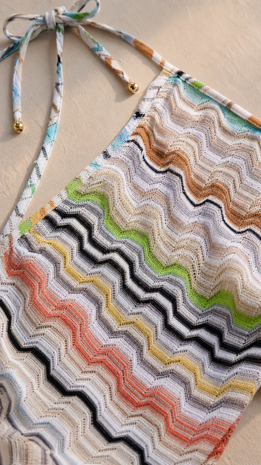 Close-up detail of multi-color chevron knit fabric and tie straps