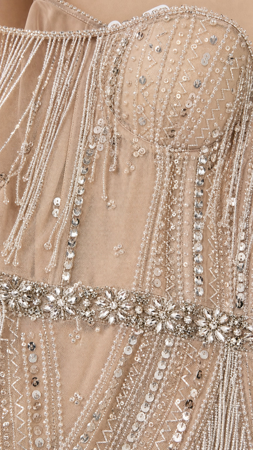 Close-up detail of bodice beadwork, sequins, and crystal waist belt