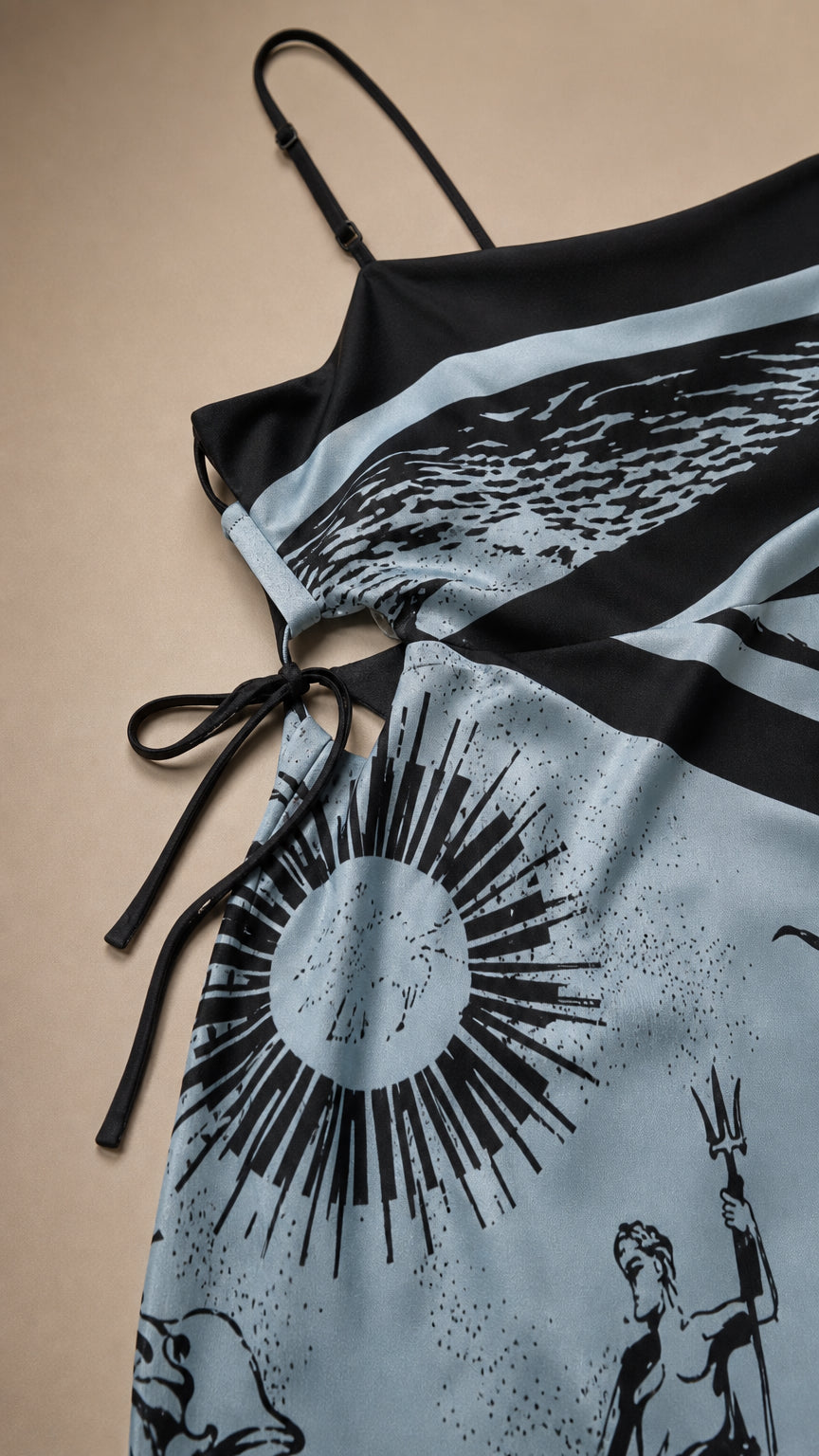 Close-up detail of side cut-out and graphic print on light blue dress