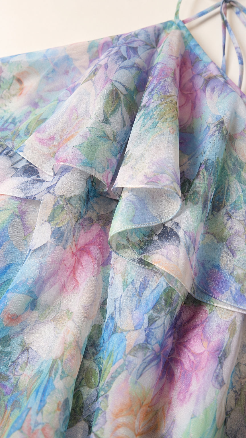 Close-up of blue floral tiered ruffle fabric texture