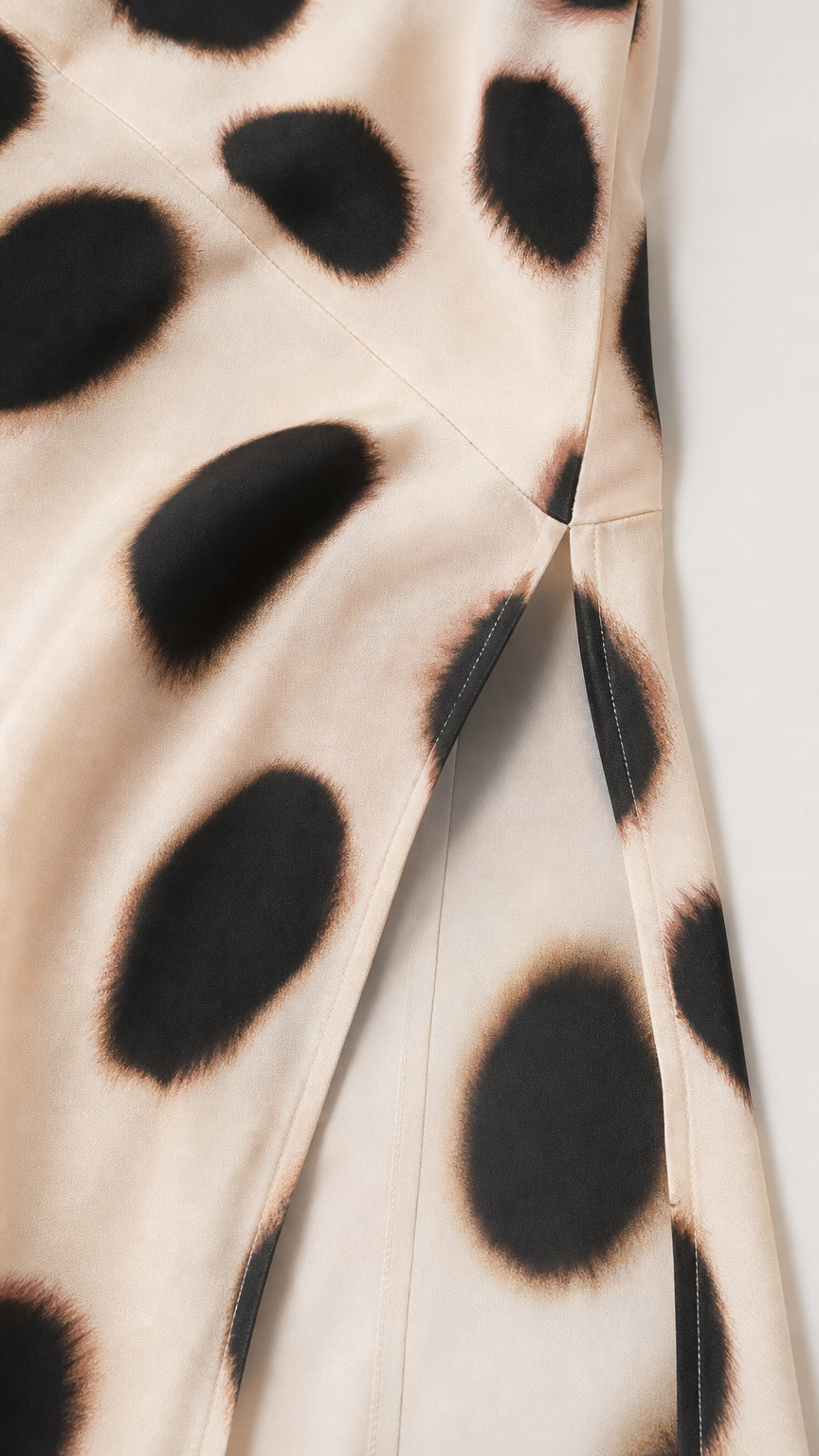 Close-up detail of fabric texture and side slit construction