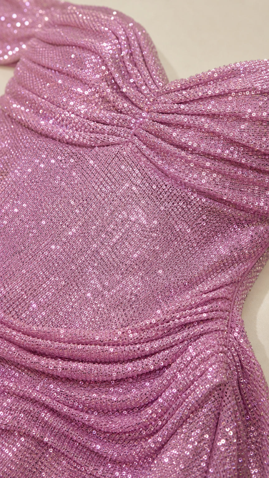 Close-up detail of pink sequin fabric and bodice
