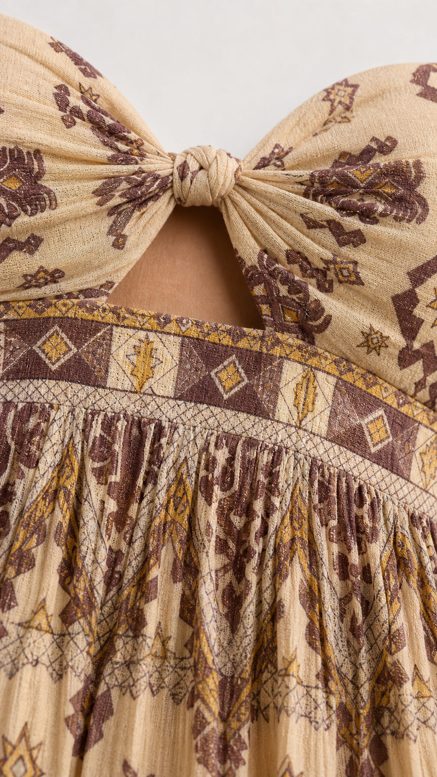 Close-up detail of tie-front knot and printed fabric