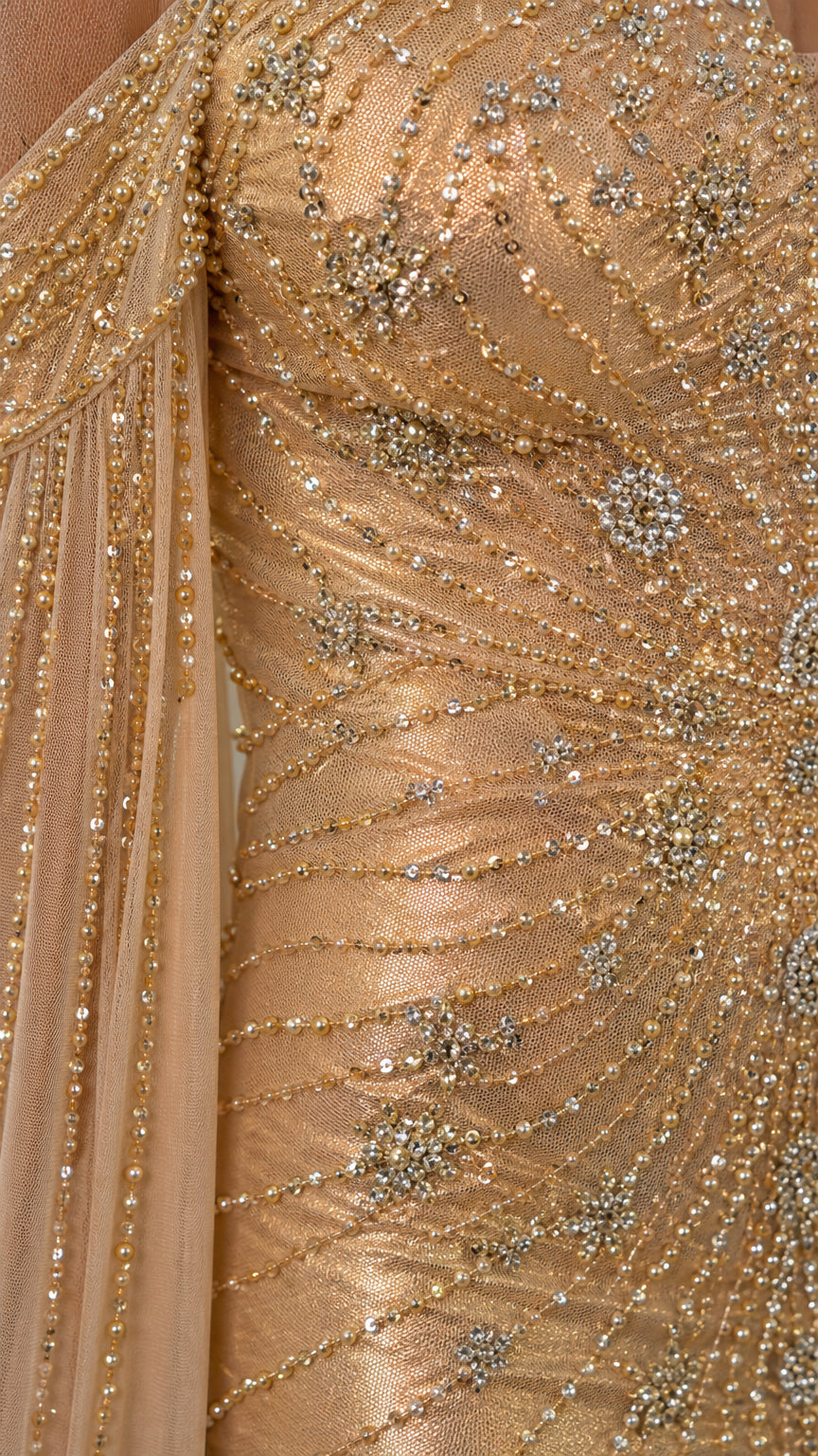 Close-up detail of beadwork and sequins on the dress