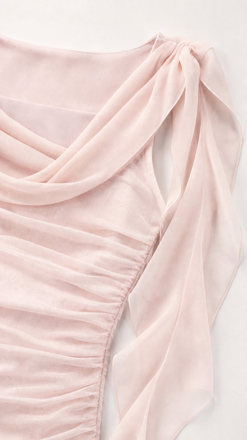 Close-up detail of draped cowl neckline and shoulder ruffles