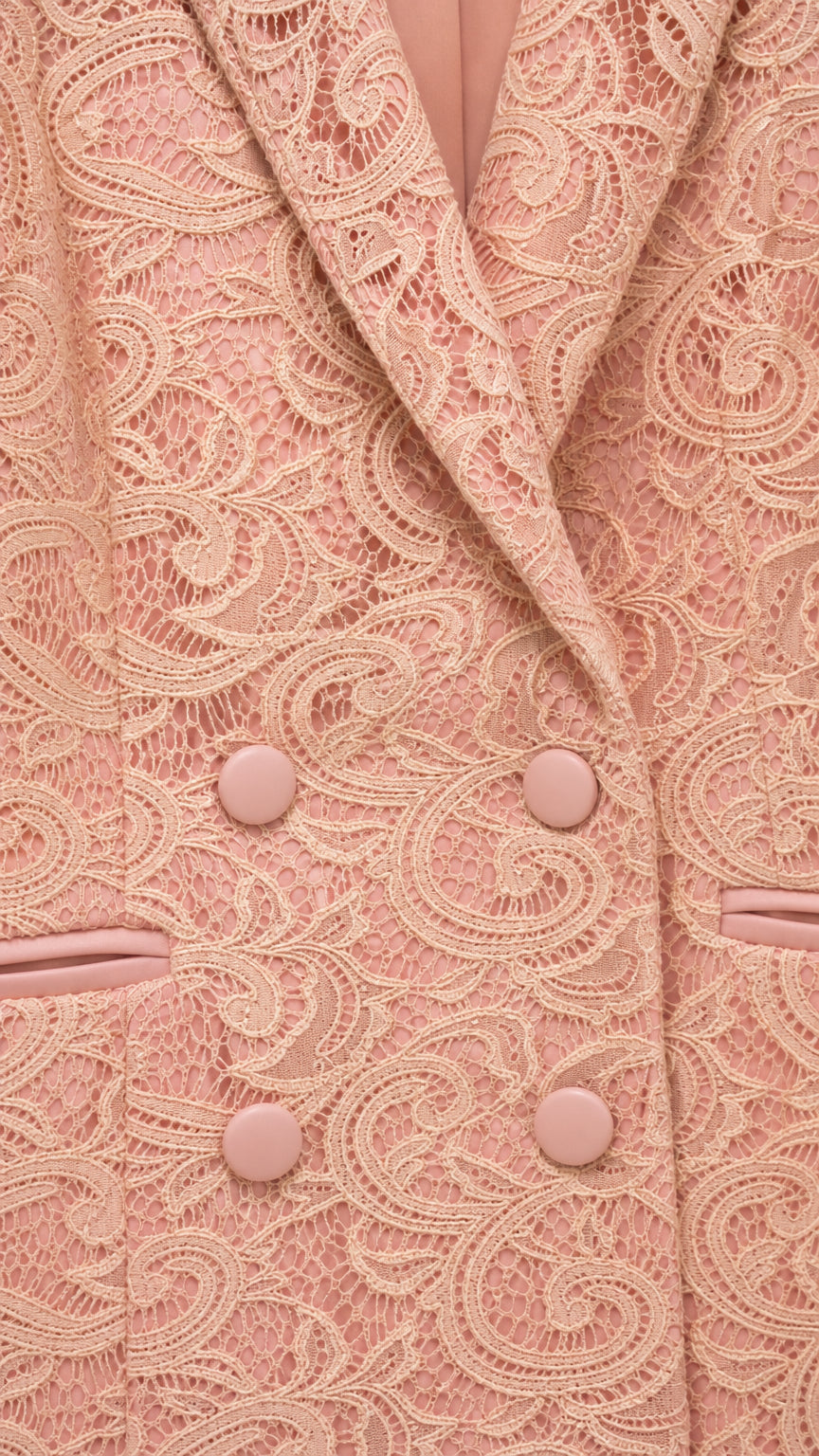 Close up of apricot lace blazer lapel and buttons