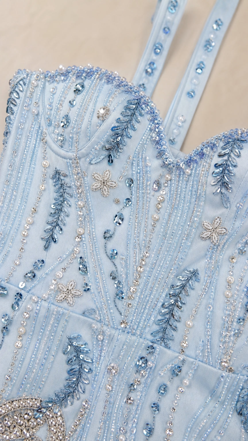 Close-up detail of bodice beads and straps